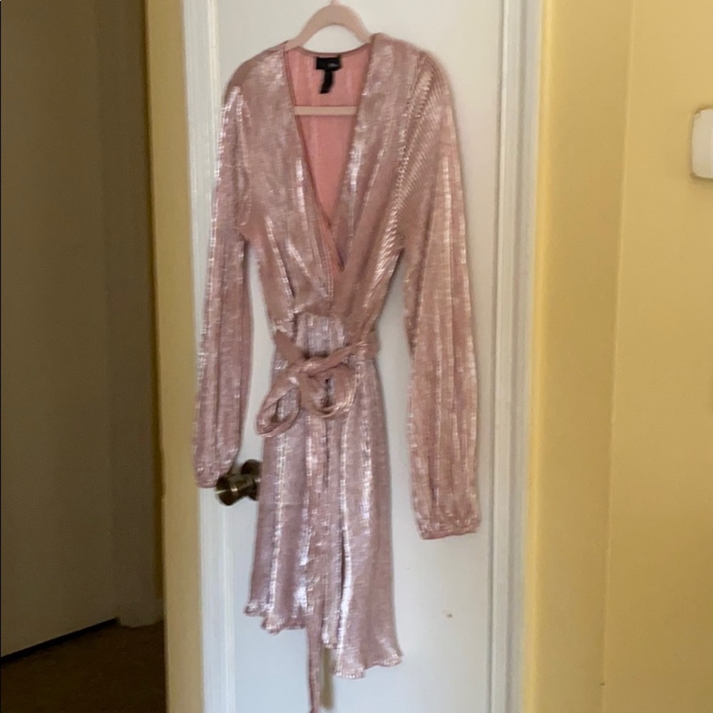 dress with crossed neck belt.